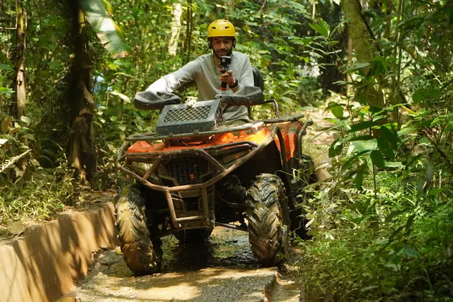 ATV quad bike riding a jungle mountain trail above Maenam on Koh Samui