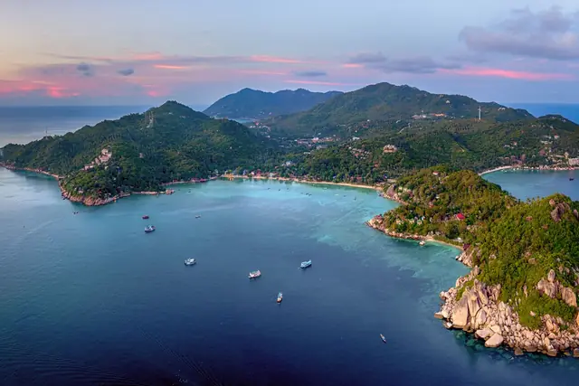 Aerial view of the headlands and bays of Koh Tao at sunset